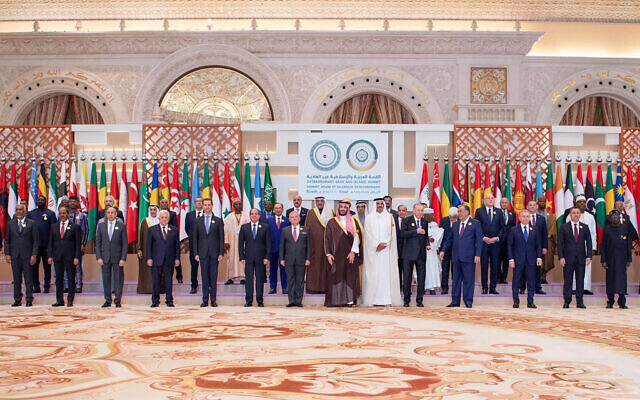 A handout picture provided by the Saudi Press Agency SPA shows Saudi Crown Prince Mohammed bin Salman, center, posing for a group picture with leaders from member states of the Organization of Islamic Cooperation (OIC) and the Arab League during their joint extraordinary summit in Riyadh on November 11, 2024. (SPA / AFP)